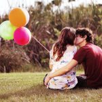 couple on lawn kissing healthy relationship